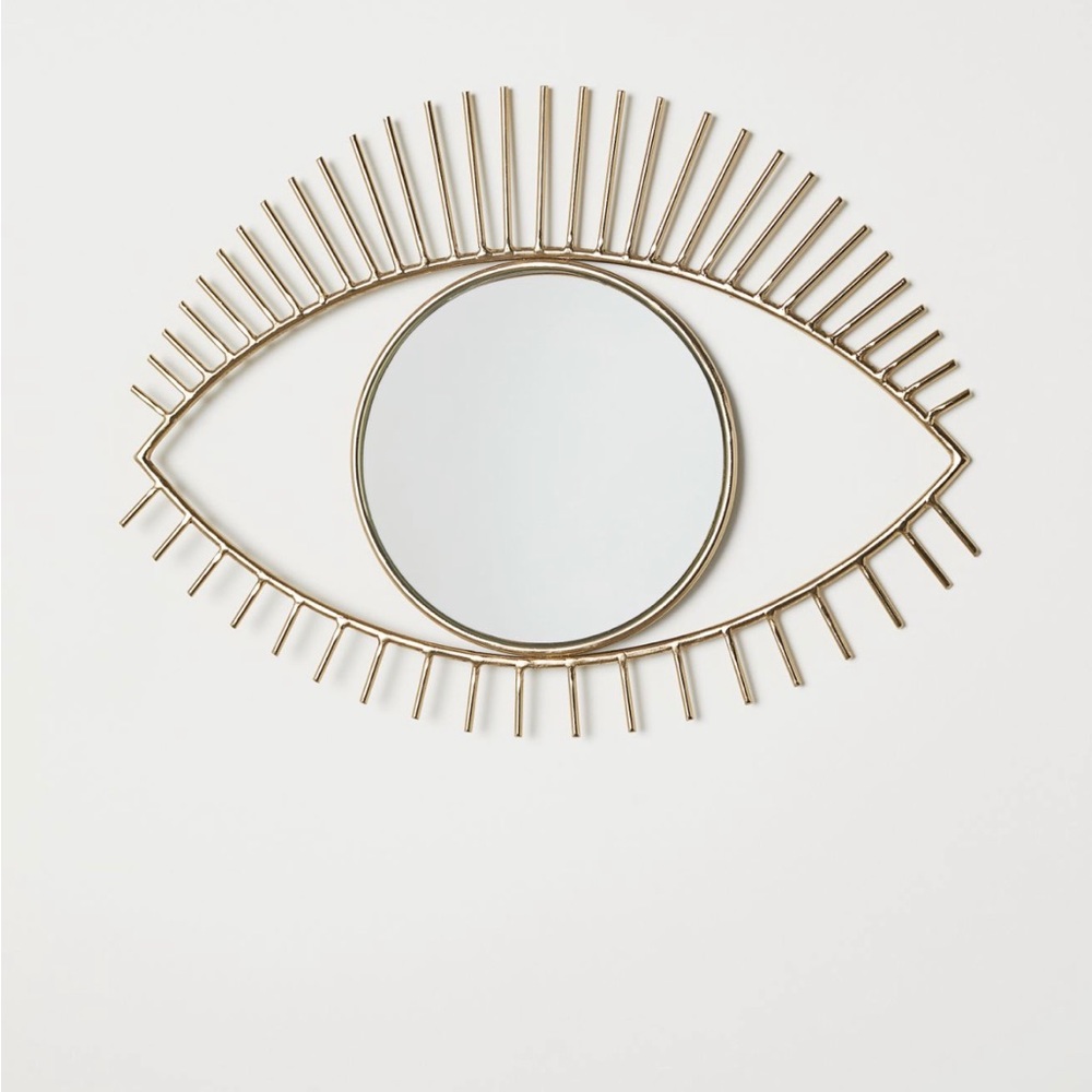Brand New Eye Shaped Mirror with metal frame in Gold.